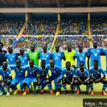 Home 18 남수단 대표 축구팀 - A dynamic South Sudan national football team match scene, showcasing a diverse group of young male p...